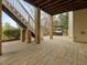 Covered patio with brick support columns, stairs, a grill, and access to the backyard at 9220 Meadow Mist Ct, Raleigh, NC 27617