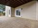 Expansive outdoor patio featuring double doors and ample space for entertaining at 9220 Meadow Mist Ct, Raleigh, NC 27617