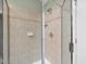 Shower stall featuring tiled walls and a glass door at 9220 Meadow Mist Ct, Raleigh, NC 27617