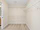 Bright walk-in closet featuring carpet and wire shelving for optimal organization at 9220 Meadow Mist Ct, Raleigh, NC 27617