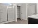 Bathroom with shower stall and open shelving storage at 4867 Pioneer Dr, Sanford, NC 27330