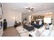 Open-concept living room featuring stylish furniture, recessed lighting, and seamless flow into the gourmet kitchen at 4867 Pioneer Dr, Sanford, NC 27330