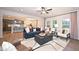 The spacious open-concept living room showcases neutral tones, large windows, and seamless access to the kitchen at 4867 Pioneer Dr, Sanford, NC 27330