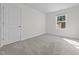 Well-lit bedroom featuring a window and neutral carpet and ample space at 103 Gladstone Loop, Clayton, NC 27520