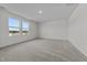 Bright bedroom featuring large windows offering neighborhood views at 103 Gladstone Loop, Clayton, NC 27520