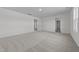 Spacious bedroom featuring neutral carpet, fresh paint, and ample natural light at 103 Gladstone Loop, Clayton, NC 27520