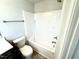 The bathroom features a bathtub with shower, toilet, and a gray vanity at 107 Southern Estates Dr, Sanford, NC 27330