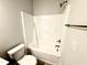 Bathroom with tub, toilet, and chrome fixtures at 107 Southern Estates Dr, Sanford, NC 27330