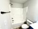 This bathroom includes a toilet, tub and shower combo, and towel rack at 107 Southern Estates Dr, Sanford, NC 27330