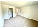 A bedroom with doors, a closet, plush carpeting and neutral walls at 107 Southern Estates Dr, Sanford, NC 27330