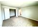 This bedroom has a walk in closet and two doors at 107 Southern Estates Dr, Sanford, NC 27330