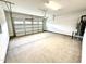 Spacious two car garage featuring concrete flooring and updated garage door at 107 Southern Estates Dr, Sanford, NC 27330