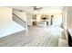 Open concept floor plan features luxury vinyl plank flooring, fireplace and modern stairs at 107 Southern Estates Dr, Sanford, NC 27330
