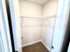 This walk-in closet includes carpeting and wire shelving at 107 Southern Estates Dr, Sanford, NC 27330