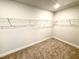 Spacious walk-in closet featuring carpeted floors and wire shelving at 107 Southern Estates Dr, Sanford, NC 27330