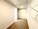 This walk-in closet features carpeted floors, wire shelving, and an access door at 107 Southern Estates Dr, Sanford, NC 27330