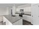 Kitchen featuring white cabinets, stainless steel appliances, granite counters, and gray hard surface floors at 109 Gladstone Loop, Clayton, NC 27520