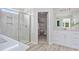 Modern bathroom featuring a glass enclosed shower, double vanity, and walk-in closet at 1107 Shovelhead Dr # Homesite 39, Durham, NC 27703
