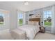 Charming bedroom with stylish wallpaper, natural light, and views of the outdoors at 1107 Shovelhead Dr # Homesite 39, Durham, NC 27703