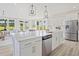 Bright, open kitchen with stainless steel appliances, a large island, and ample natural light at 1107 Shovelhead Dr # Homesite 39, Durham, NC 27703
