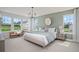 Bright main bedroom with many windows, neutral carpet, ensuite bath, and a lovely chandelier at 1107 Shovelhead Dr # Homesite 39, Durham, NC 27703