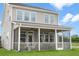 Relaxing screened porch with ceiling fans, comfortable seating, and views of the backyard at 1107 Shovelhead Dr # Homesite 39, Durham, NC 27703