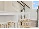 Close-up of a modern staircase design with light-colored carpet and dark wood railing at 1107 Shovelhead Dr # Homesite 39, Durham, NC 27703