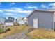 Spacious backyard with manicured lawn and hardscaped walkway leading to a detached garage at 1136 Remey Ave, Wake Forest, NC 27587