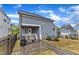Backyard features a covered patio, paved area, and a well-maintained lawn, perfect for outdoor gatherings at 1136 Remey Ave, Wake Forest, NC 27587