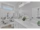 Bright bathroom with double sink vanity, quartz countertop, and modern fixtures at 1136 Remey Ave, Wake Forest, NC 27587