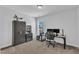 Well-lit bedroom with a desk, chair, and a bookcase, ideal for use as a home office or study at 1136 Remey Ave, Wake Forest, NC 27587