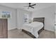 Cozy bedroom with natural light, featuring a bed with storage drawers and a ceiling fan at 1136 Remey Ave, Wake Forest, NC 27587