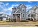 Attractive two-story home with a charming front porch and manicured lawn, creating a welcoming curb appeal at 1136 Remey Ave, Wake Forest, NC 27587
