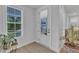 Bright foyer featuring stylish flooring, a large window, and a welcoming view of the front door at 1136 Remey Ave, Wake Forest, NC 27587