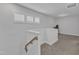 Upstairs hallway featuring three windows that offers bright natural light leading to multiple rooms at 1136 Remey Ave, Wake Forest, NC 27587