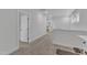 Bright hallway with carpet and lots of natural light with entryways leading to several rooms at 1136 Remey Ave, Wake Forest, NC 27587