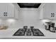 Close-up of the modern kitchen counter featuring elegant backsplash and sleek appliances at 1136 Remey Ave, Wake Forest, NC 27587