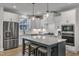 Modern kitchen featuring a large island, stainless steel appliances, and ample counter space at 1136 Remey Ave, Wake Forest, NC 27587