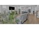Open concept living area with a view of the kitchen featuring sleek, light-toned couches and light flooring at 1136 Remey Ave, Wake Forest, NC 27587