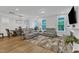Spacious living room flows into dining area, featuring comfortable seating, and natural light at 1136 Remey Ave, Wake Forest, NC 27587