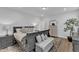 Spacious primary bedroom with modern decor, plush bedding, and ample natural light offering a relaxing retreat at 1136 Remey Ave, Wake Forest, NC 27587