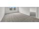 Roomy bedroom with soft carpeting, bright lighting, and a hallway view at 1137 Solace Way, Rolesville, NC 27571