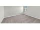 Clean bedroom featuring neutral tones, plush carpeting, and a sunlit window at 1137 Solace Way, Rolesville, NC 27571