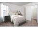 Bright bedroom with a window, bedside table, and access to the closet at 1137 Solace Way, Rolesville, NC 27571