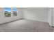 Spacious bedroom with soft carpeting and large windows that provide plenty of natural light at 1137 Solace Way, Rolesville, NC 27571