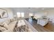 Open-concept living room with adjacent kitchen and dining area for gatherings at 1137 Solace Way, Rolesville, NC 27571