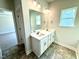 Bathroom featuring a double sink vanity, large mirror, and recessed lighting at 119 Southern Estates Dr, Sanford, NC 27330