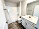 Bathroom with a shower-tub, vanity and cabinet, and a large mirror at 119 Southern Estates Dr, Sanford, NC 27330