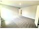 Neutral bedroom features recessed lighting, plush carpet, and an open doorway at 119 Southern Estates Dr, Sanford, NC 27330