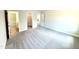 Large, carpeted room with open doorways to other rooms at 119 Southern Estates Dr, Sanford, NC 27330